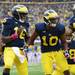Michigan senior quarterback Denard Robinson celebrates with wide receiver Jeremy Gallon after scored a touchdown against Illinois in the first quarter at Michigan Stadium on Saturday.  Melanie Maxwell I AnnArbor.com